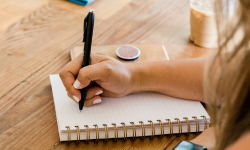 Woman taking notes in a notebook